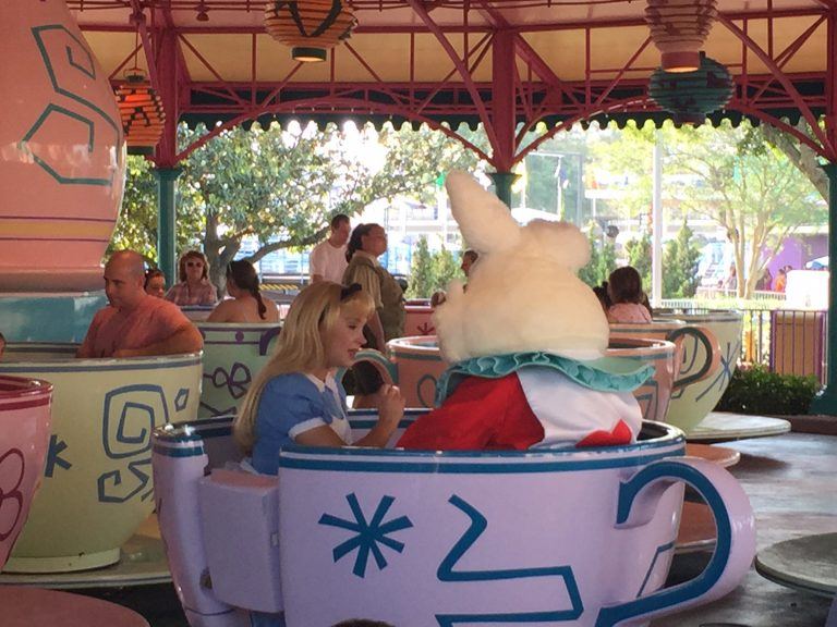 Alice and the White Rabbit riding teacups